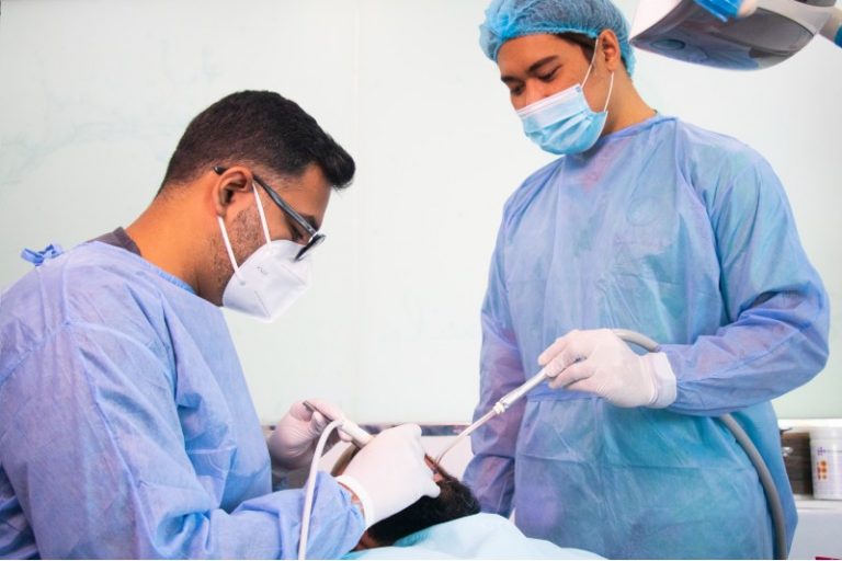 Dentist preparing for a surgical tooth extraction
