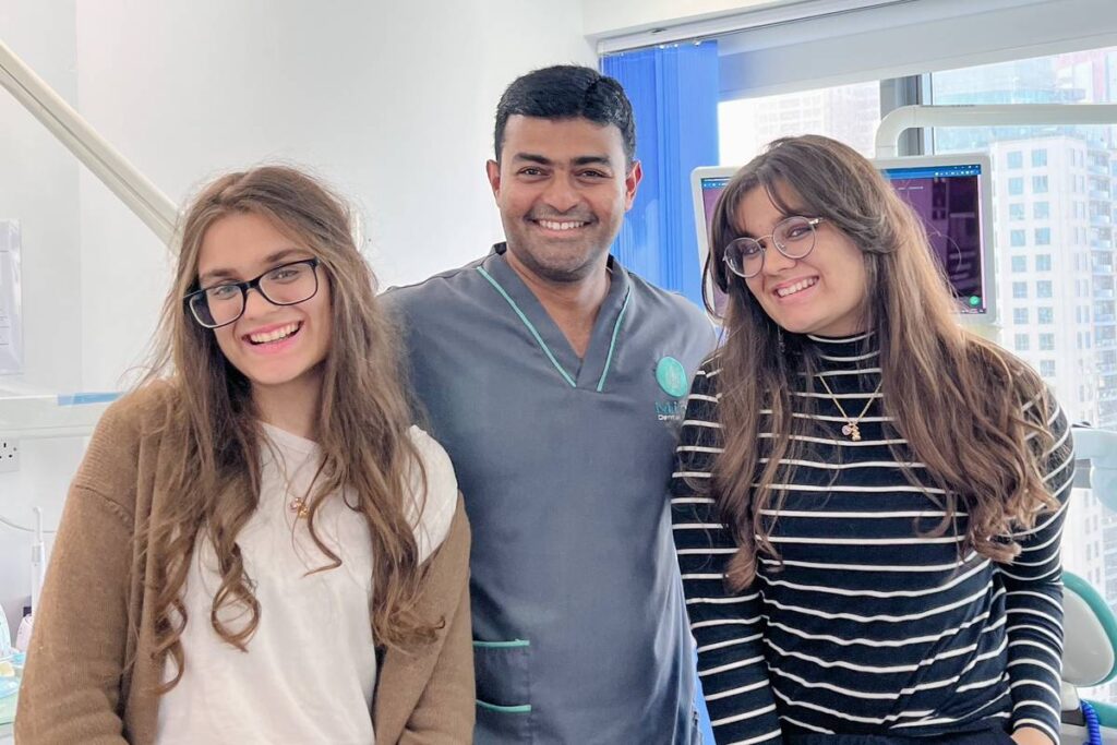Dentist with patient at Mint Dental Care