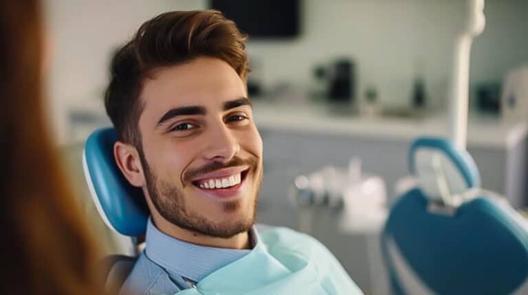 Patient smiling after wisdom tooth extraction recovery