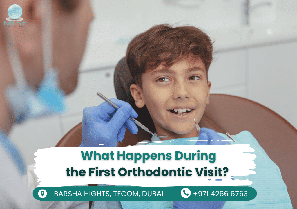 A friendly orthodontist discussing treatment options with a child and parent during their first visit.