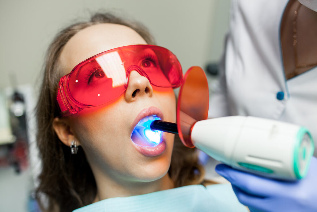 Relaxed patient receiving comfortable treatment during sedation dentistry at Mint Dental Care