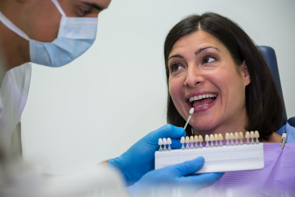 Dentist answering a patient question at Mint Dental Care