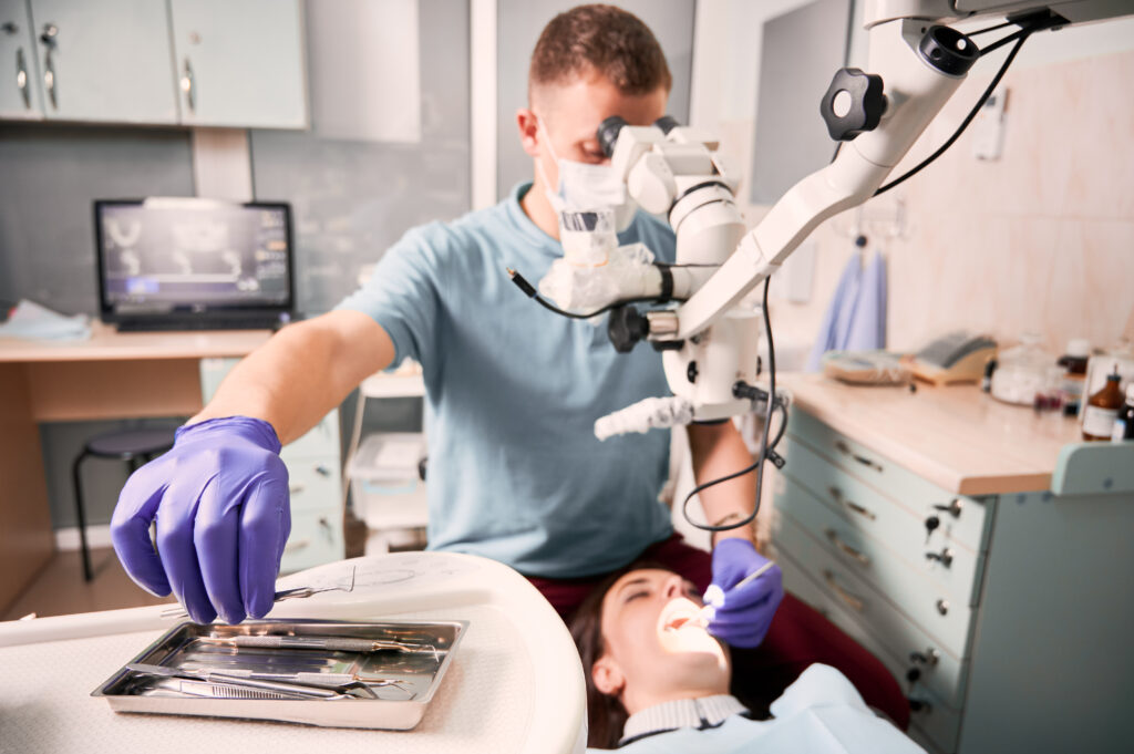 Dentist performing a laser dentistry procedure