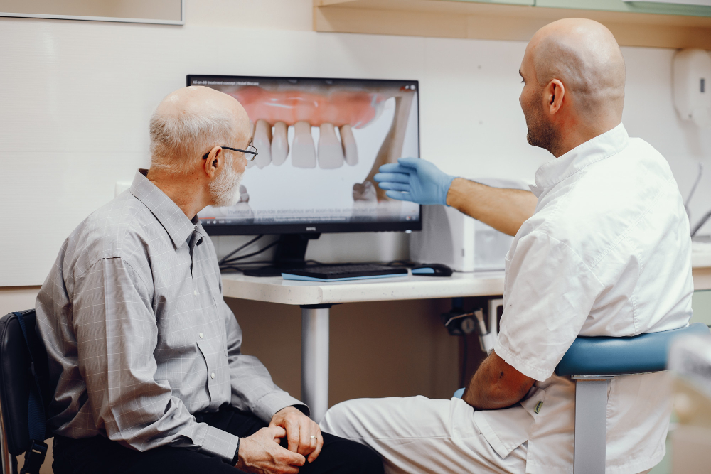 Dentist explaining the strength of a ceramic zirconia implant in Dubai