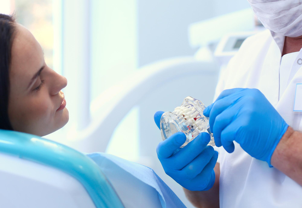 Patient holding a custom home whitening tray